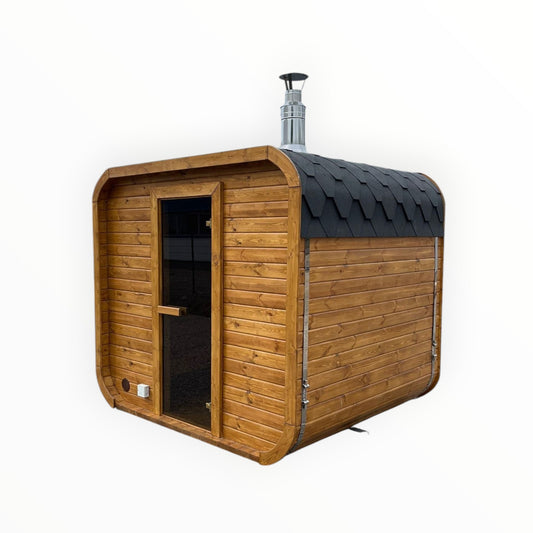 Moderne rechteckige Gartensauna aus hellem Holz mit Bitumendach und Glastür